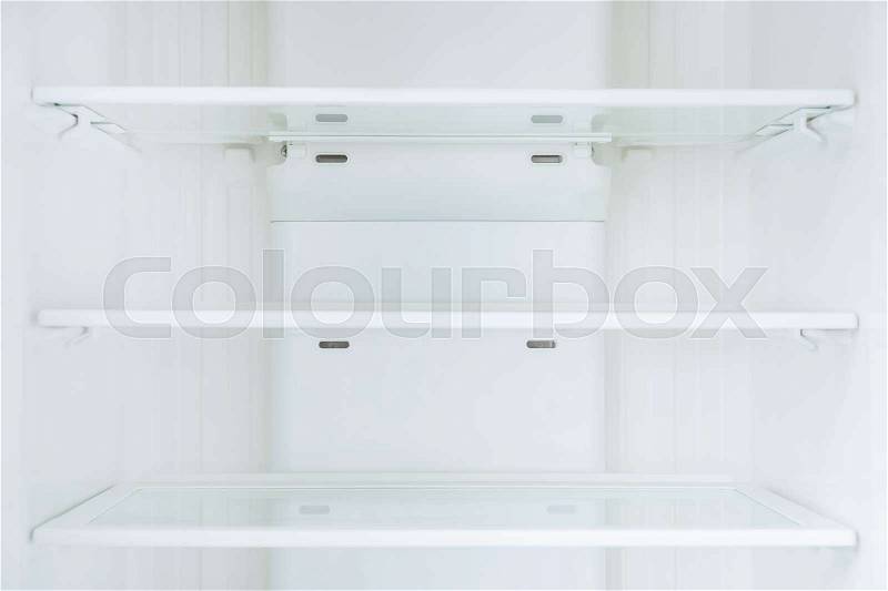 Empty shelves in refrigerator, stock photo