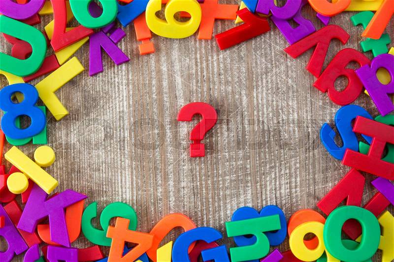 Border of colorful letters and numbers with question mark in a middle , stock photo
