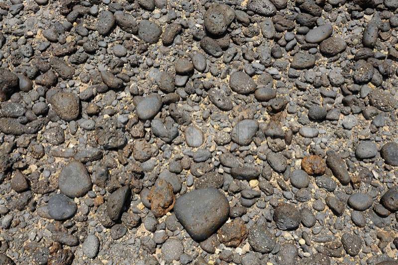 Black volcanic stones on the coast of Canary Island Fuerteventura, Spain, stock photo