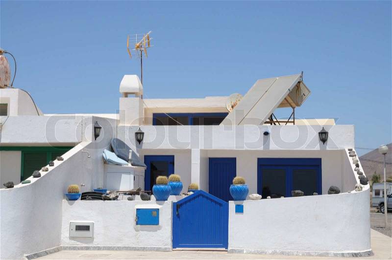 Residential white blue house on Canary Island Fuerteventura, Spain, stock photo