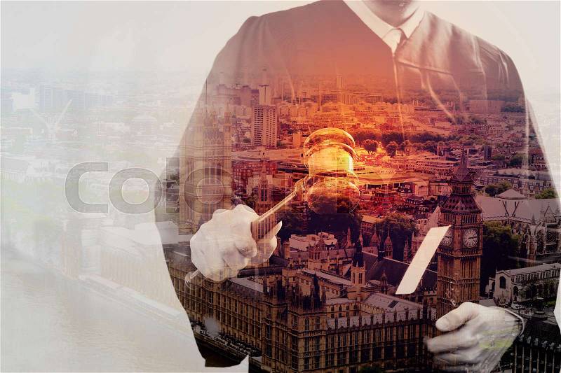 Double exposure of justice and law concept.Male judge in a courtroom with the gavel and holy book with London city , stock photo