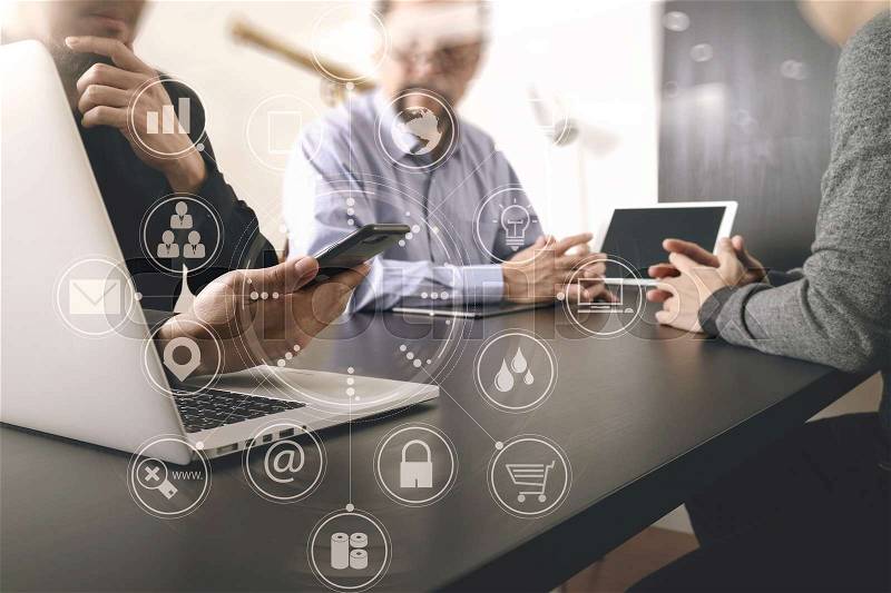 Co working team meeting concept,businessman using smart phone and digital tablet and laptop computer in modern office with virtual graph chart diagram , stock photo