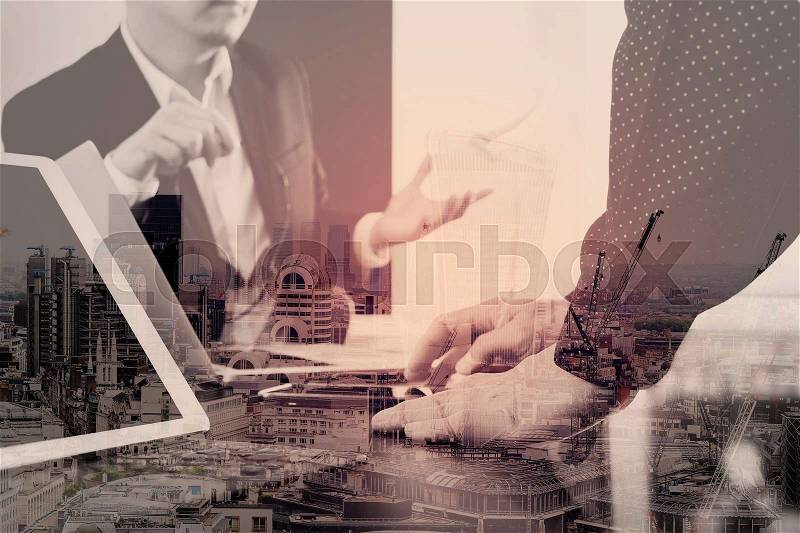 Co working team meeting concept,businessman using smart phone and digital tablet and laptop computer in modern office with London city exposure, stock photo