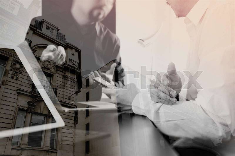Co working team meeting concept,businessman using smart phone and digital tablet and laptop computer in modern office with London city exposure , stock photo