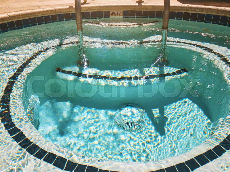 Outdoor Jacuzzi Pool with Fresh Blue Water for Massage and Spa, stock photo