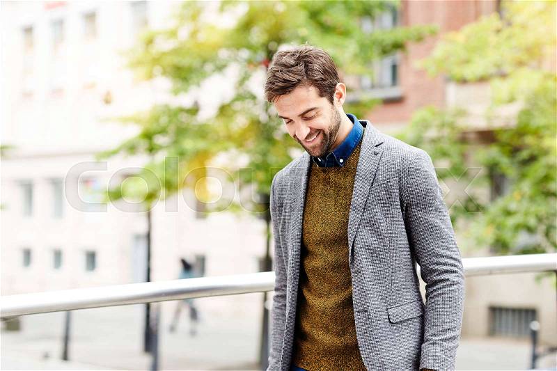Happy guy in jacket, laughing, stock photo