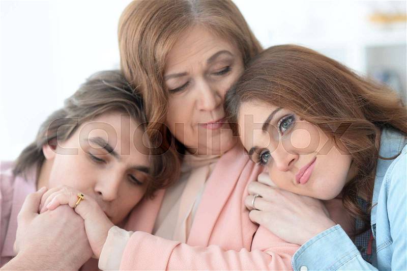 Portrait of a happy elderly mother with adult children, stock photo