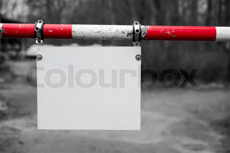 Barrier with a blank signboard, stock photo