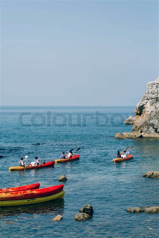 Kayaks at sea. Tourist kayaking in the sea near Dubrovnik, Croatia. Aerial Photo drone, stock photo