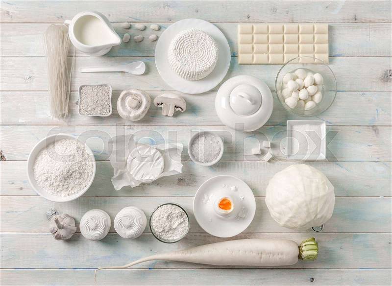 Collection of white products in the kitchen, dairy and chocolate, grains and spices, topview, stock photo