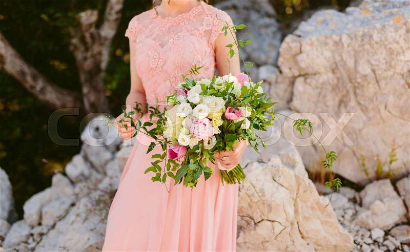 Wedding roses and peonies in the hands of the bride. Wedding in Montenegro, stock photo