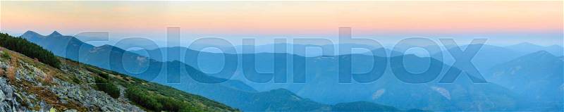 Mountain outline on morning sky background. Summer daybreak misty top view (Gorgany, Carpathians, Ukraine). Seven shots stitch high-resolution panorama, stock photo