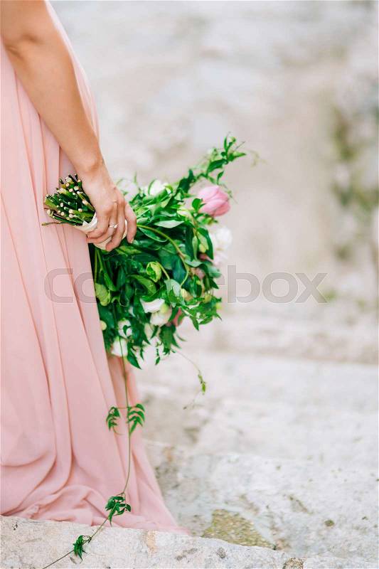 Wedding roses and peonies in the hands of the bride. Wedding in Montenegro, stock photo