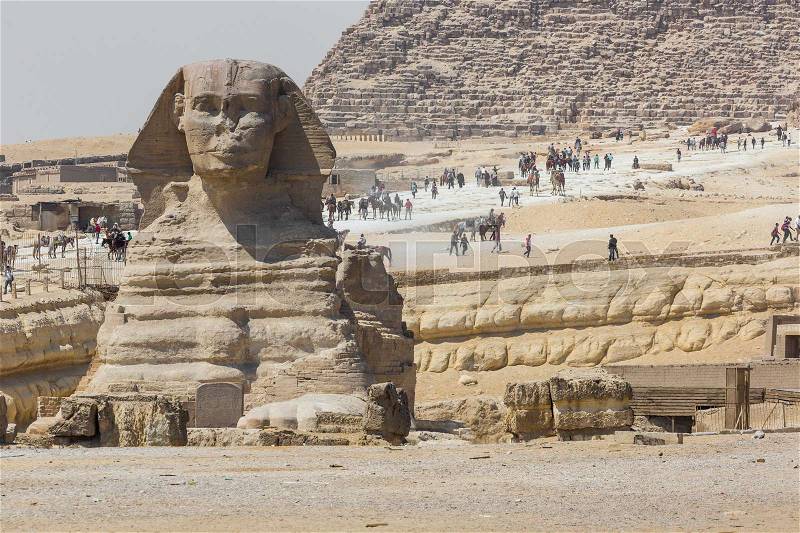 Closeup view of the Sphinx head with pyramid in Giza near Cairo, Egypt , stock photo