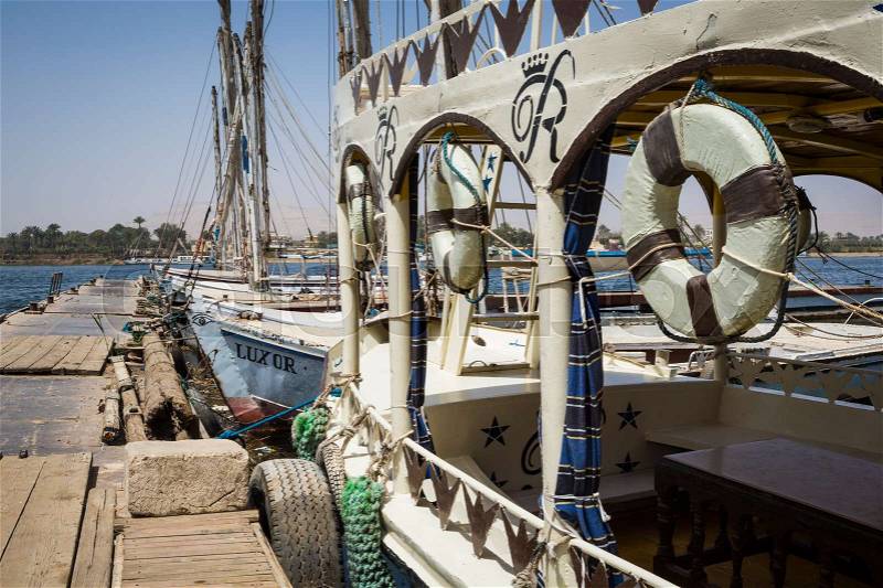 Wooden boats felucca at the Nile River in Aswan, Egypt, North Africa, stock photo