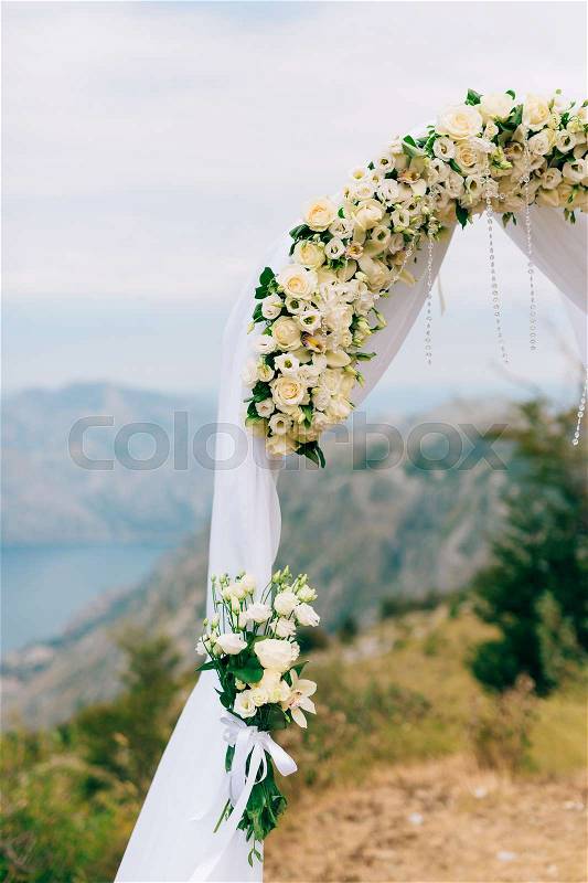 A wedding in the mountains. Wedding arch for the ceremony on the summit of Mount Lovcen in Montenegro, stock photo