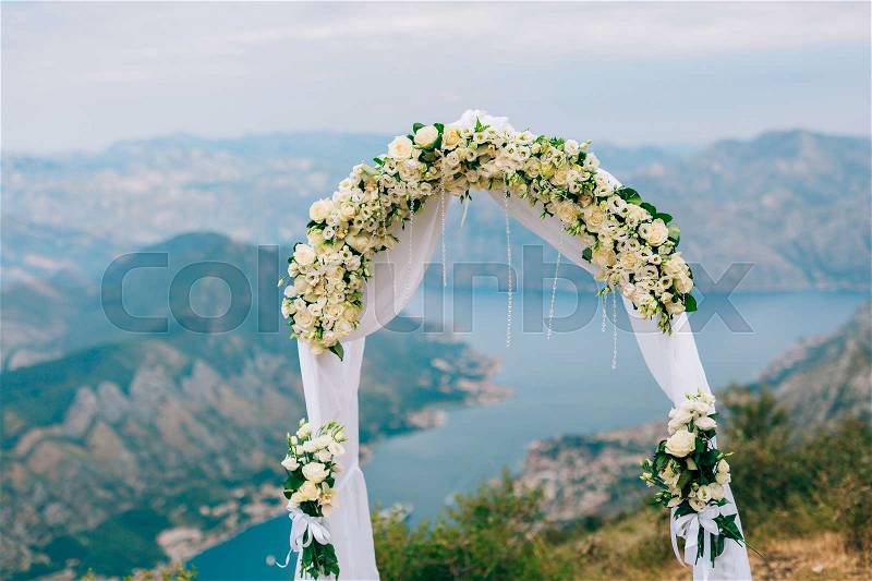 A wedding in the mountains. Wedding arch for the ceremony on the summit of Mount Lovcen in Montenegro, stock photo