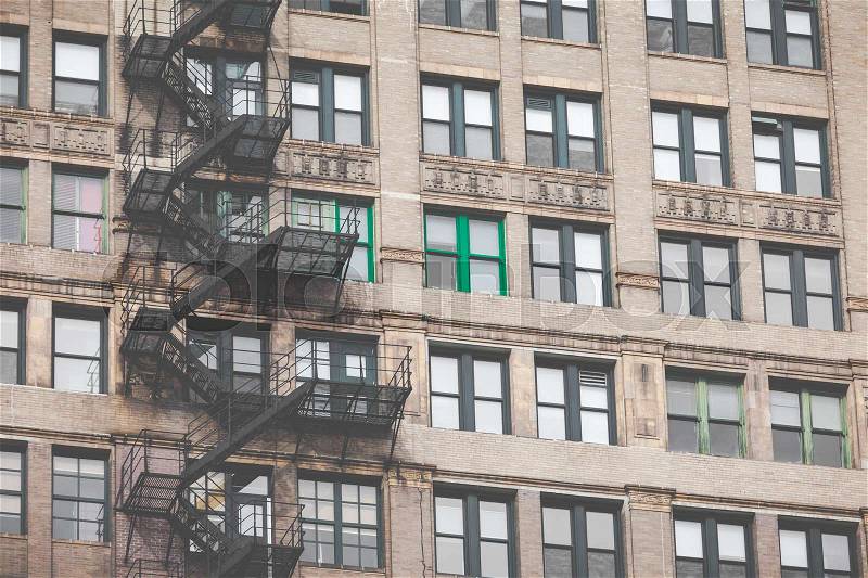 Metal fire escape outside apartment building for emergency , stock photo