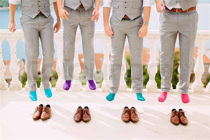Men in colorful socks. Funny wedding photos. Wedding in Montenegro, stock photo