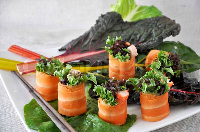 Colorful veggie rolls on plate with chopstick, stock photo