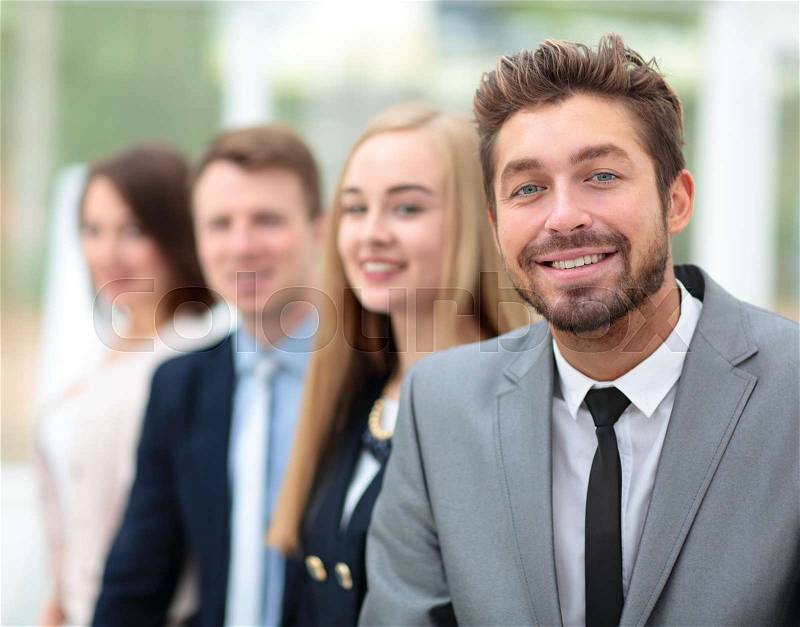 Elegant co-workers looking at camera during meeting in office, stock photo