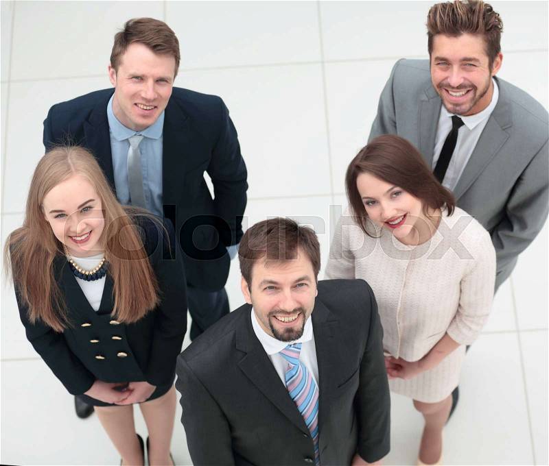 Elegant co-workers looking at camera during meeting in office, stock photo
