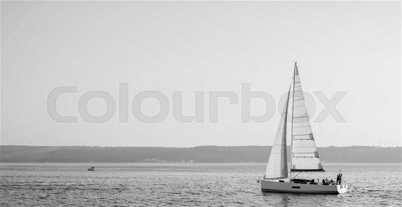 Sailing ship luxury yacht in Adriatic sea black and white, stock photo