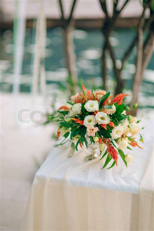 Wedding bridal bouquet of Proteus, Verdure Italian , Lisianthus on a table. Wedding in Montenegro, Adriatic, stock photo