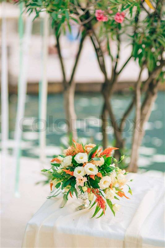 Wedding bridal bouquet of Proteus, Verdure Italian , Lisianthus on a table. Wedding in Montenegro, Adriatic, stock photo