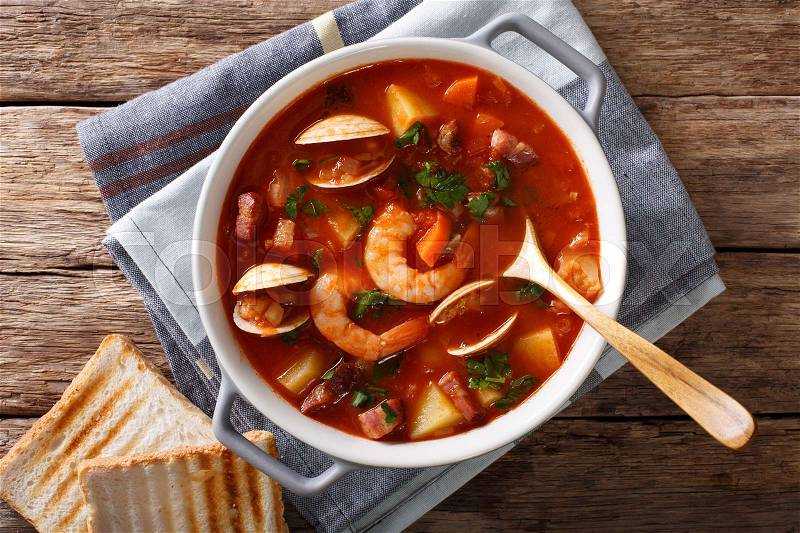 American cuisine: Manhattan clam chowder soup closeup on the table. horizontal view from above , stock photo