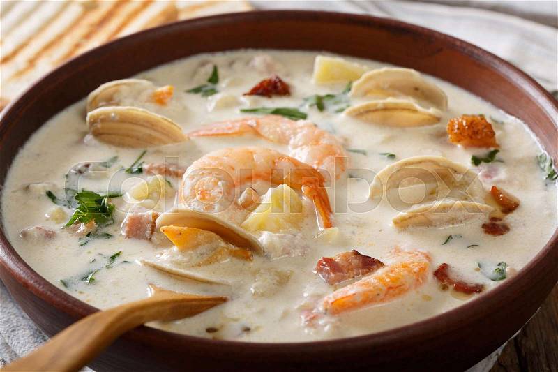 American cuisine: New England clam chowder soup macro on the table. horizontal , stock photo