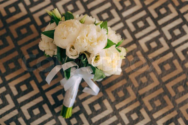 Wedding roses and peonies on texture with ornament. Wedding in Montenegro, stock photo