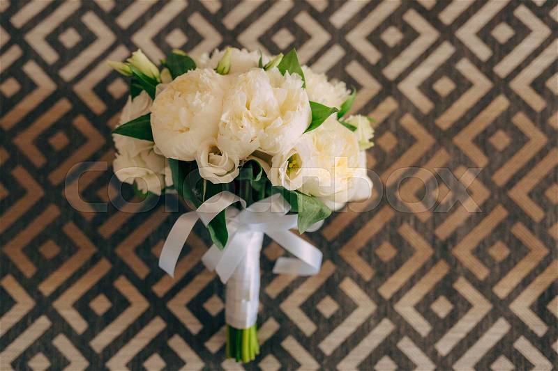 Wedding roses and peonies on texture with ornament. Wedding in Montenegro, stock photo
