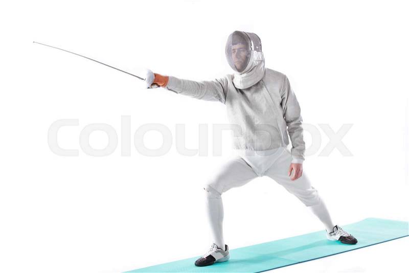 Side view of fencer in uniform training with rapier in hand on white, stock photo