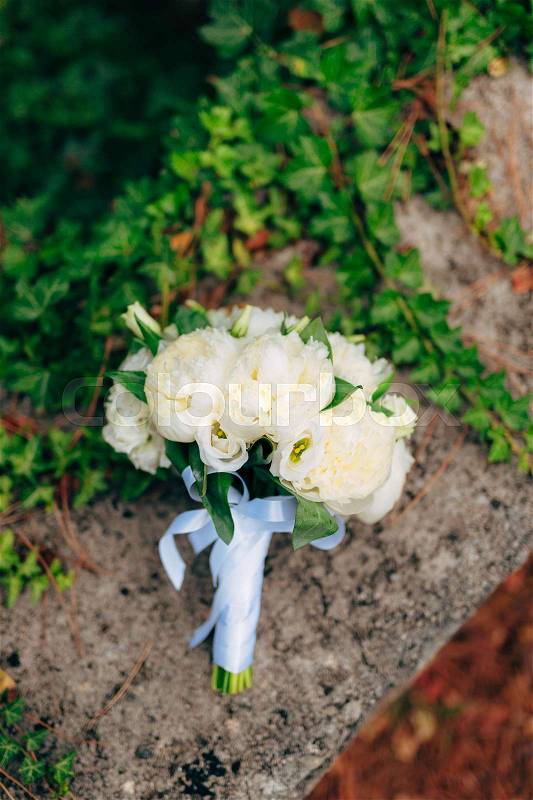 Wedding roses and peonies on the rocks. Wedding in Montenegro, Adriatic, stock photo