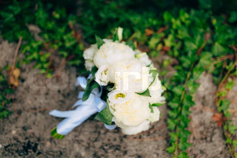 Wedding roses and peonies on the rocks. Wedding in Montenegro, Adriatic, stock photo
