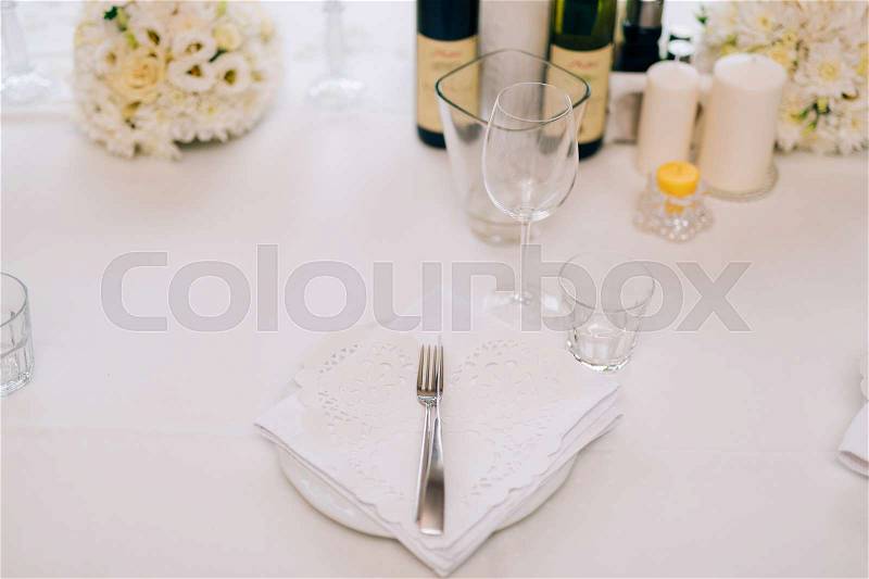 Plates at the wedding banquet. Table setting. Wedding decorations. Wedding at the sea in Montenegro, stock photo