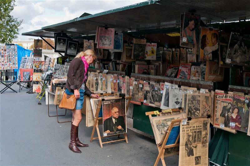 Adult woman walking the art market, stock photo
