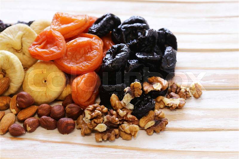 Assorted various dried fruits (dried apricots, prunes, figs), stock photo