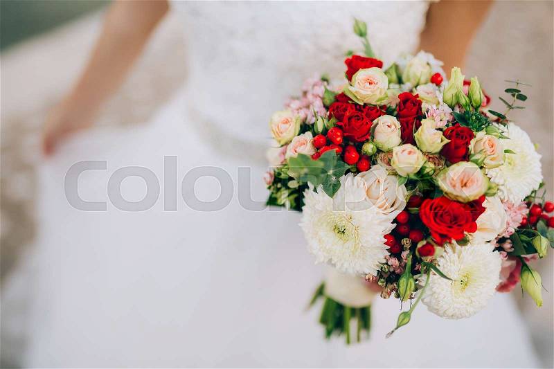 Wedding bridal bouquet of roses, chrysanthemums, Eucalyptus Baby Blue in the hands of the bride. Wedding in Montenegro, Adriatic, stock photo