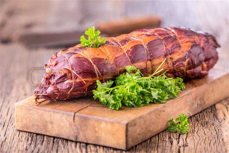 Pork meat.Pork chop smoked. Traditional smoked meat on oak wooden table in other positions, stock photo