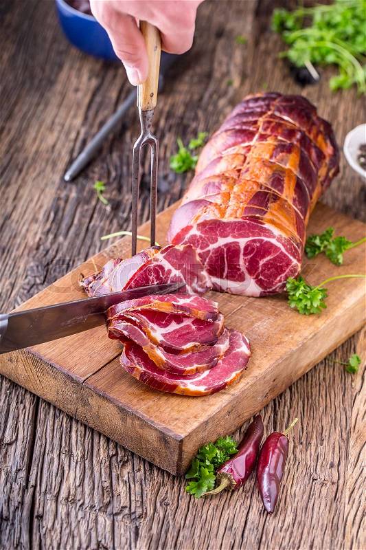 Pork meat.Pork chop smoked. Traditional smoked meat on oak wooden table in other positions, stock photo