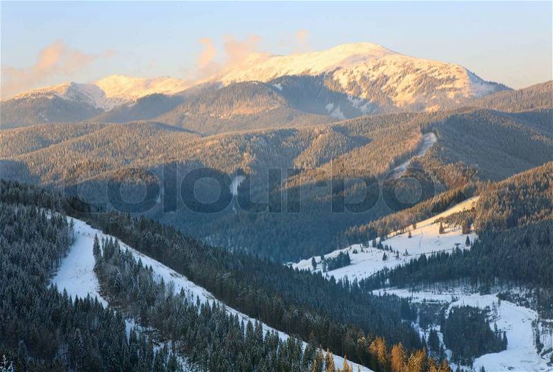 Winter calm mountain landscape (view from Bukovel ski resort (Ukraine) to Svydovets ridge), stock photo
