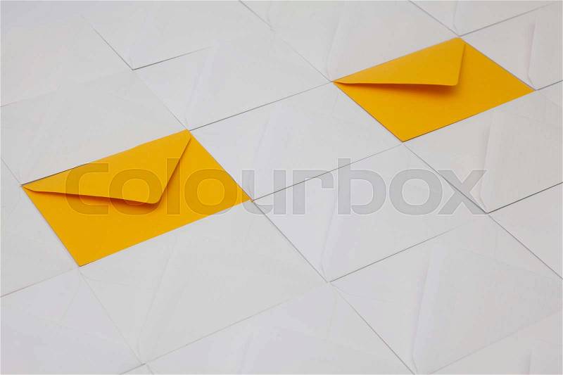 Composition with white and yellow envelopes on the table, stock photo