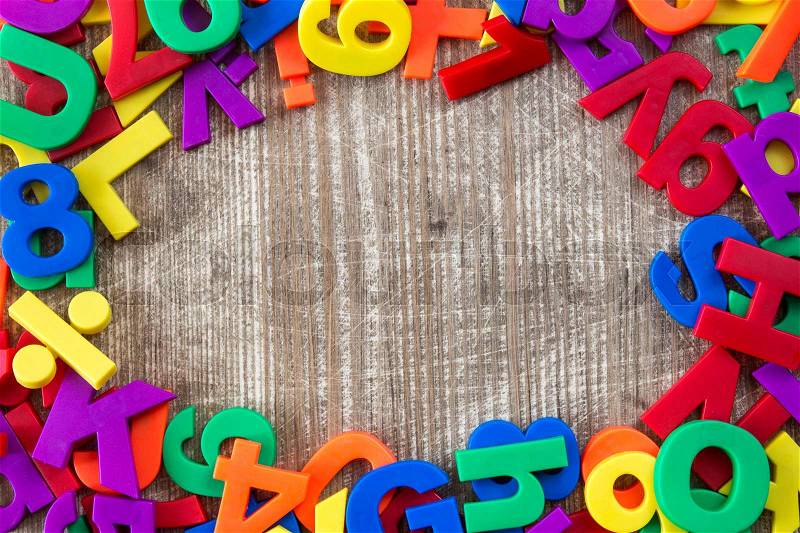 Border of colorful letters and numbers with copy-space, stock photo