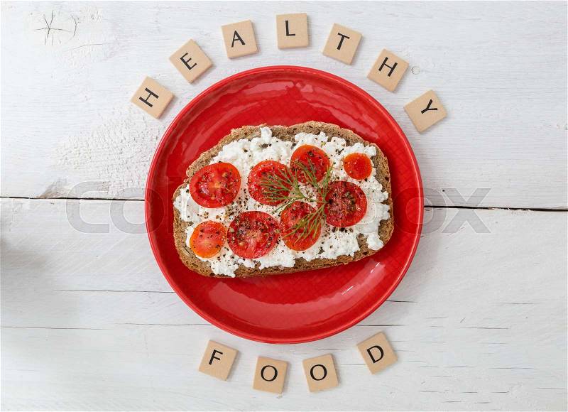 Healthy food letters with tomato bread, stock photo