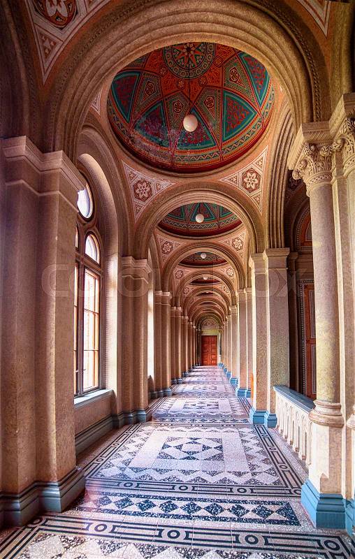 Marble interior of Chernivtsi University campus hallway with arch, perspective view. UNESCO monument in Ukraine, stock photo