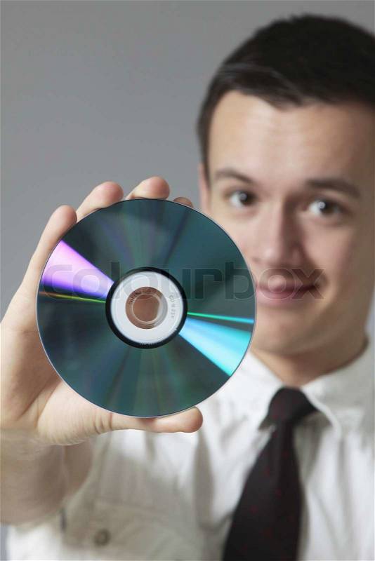 Young man and CD, stock photo