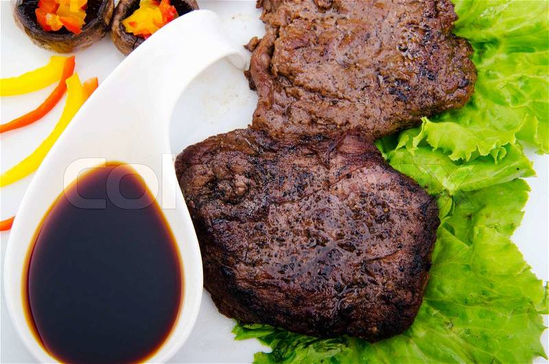 Well done steak served in the plate, stock photo