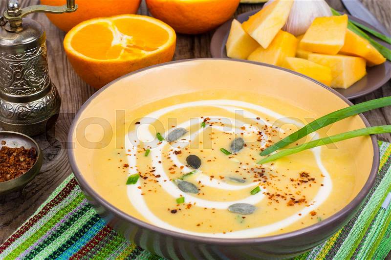 Fruit and vegetable dietary soup with orange. Studio Photo, stock photo